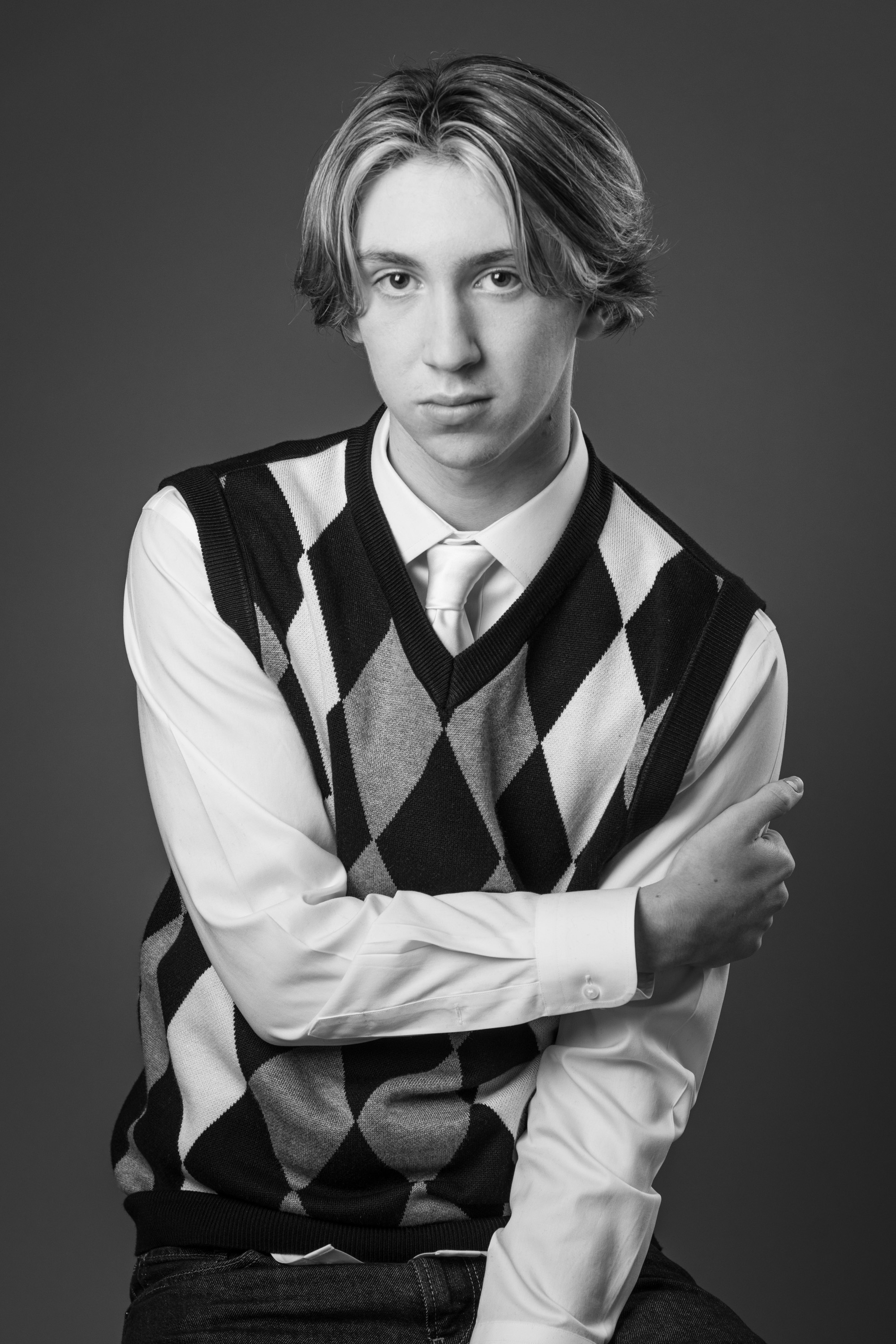 young man dressed in argyle vest