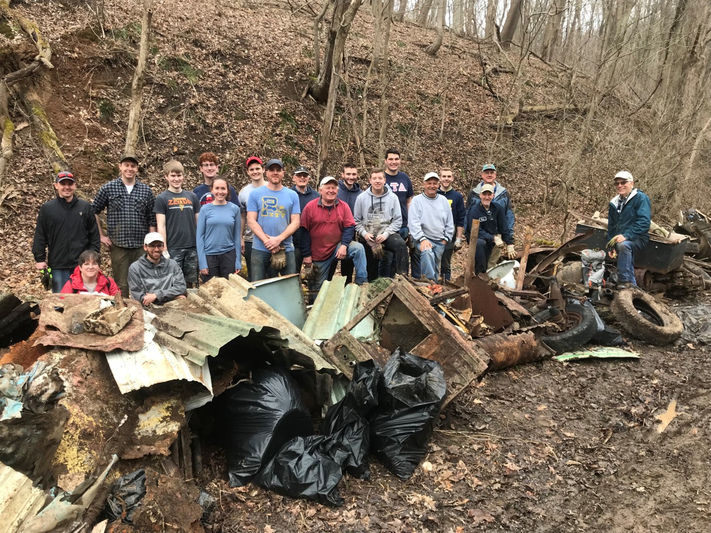 WPC volunteers and staff show the massive amount of clean up they accomplished on a workday at Toms Run Nature Reserve.