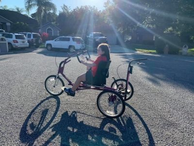 Hannah Killebrew riding an adaptive bike from The Dream Bike Sponsorship Program