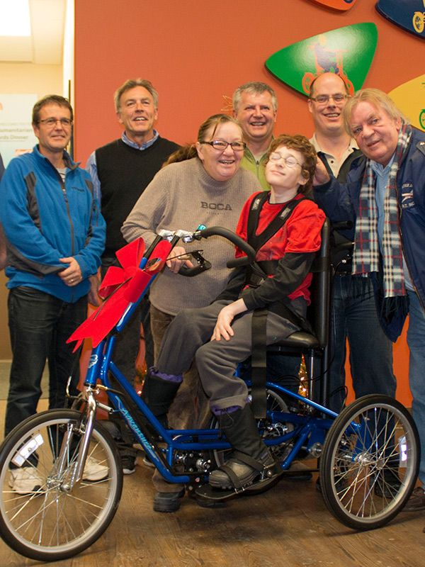 A child with special needs on an adaptive bike from Freedom Concepts