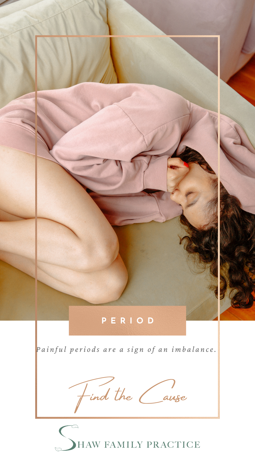 Picture of a black woman in a pink hoodie curled up on couch in pain.