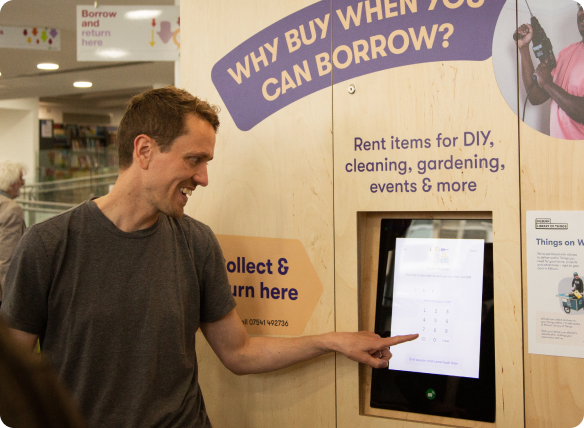 Borrower smiling using the touch screen
