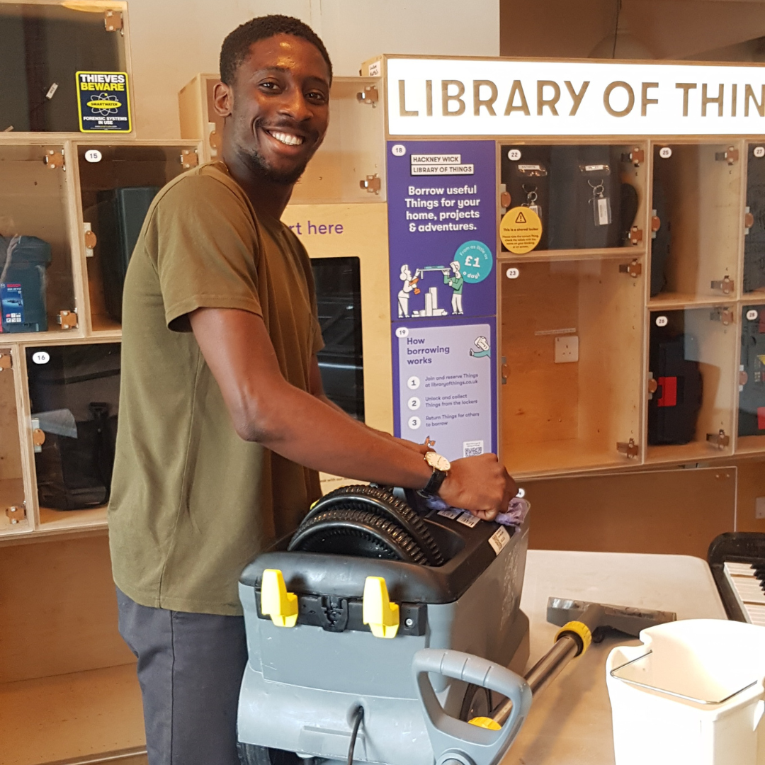 Image of a technician with a carpet cleaner