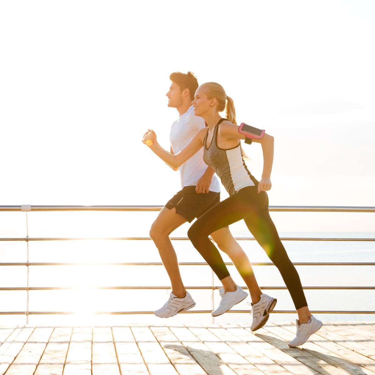 Young Athletic Couple Running