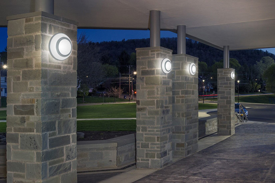 Wall mounted Millenium Saturns installed on pillars around exterior pathways