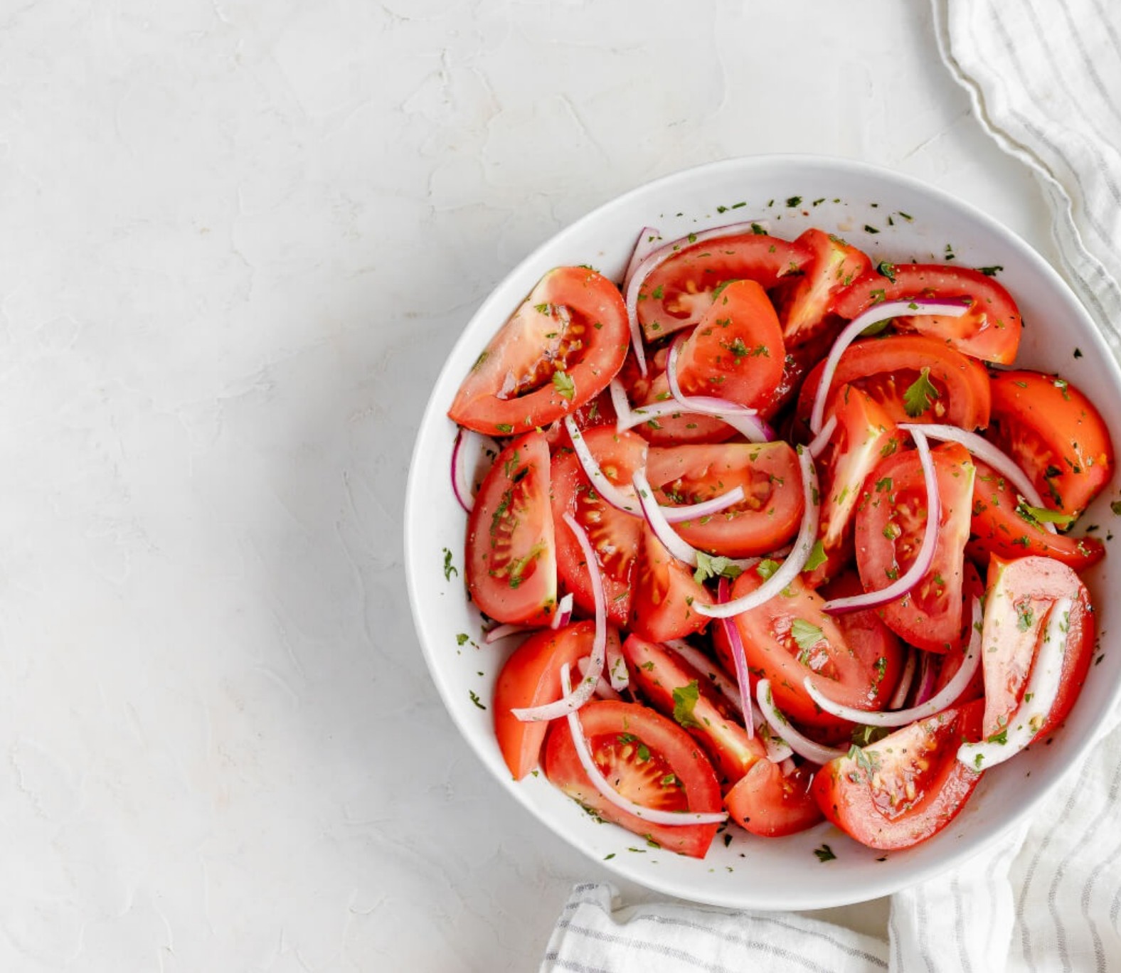 Fresh Chilean-style salad with tomatoes, cucumbers, onions, and herbs—an anti-inflammatory side dish full of vibrant flavor.