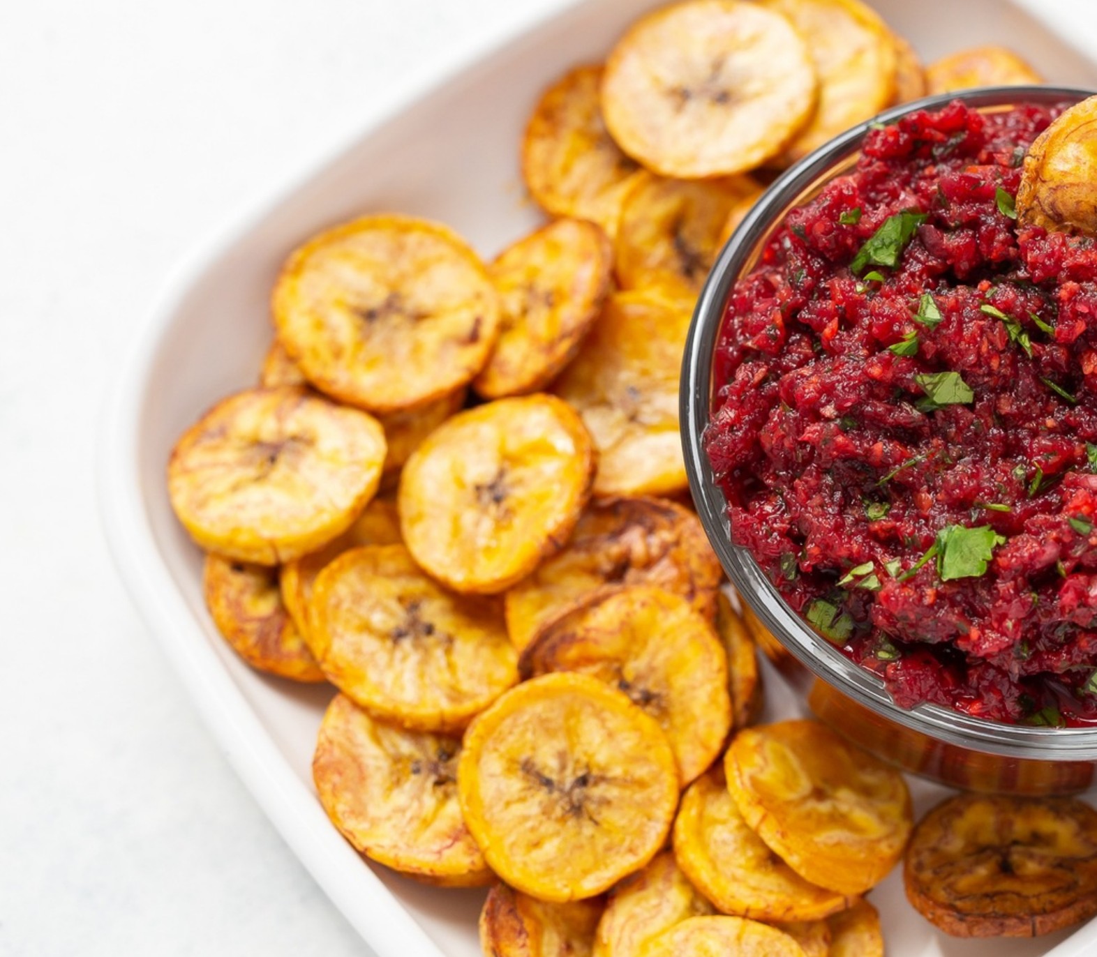 Bright carrot and beet salsa paired with crunchy plantain chips—an AIP-compliant snack packed with nutrients.