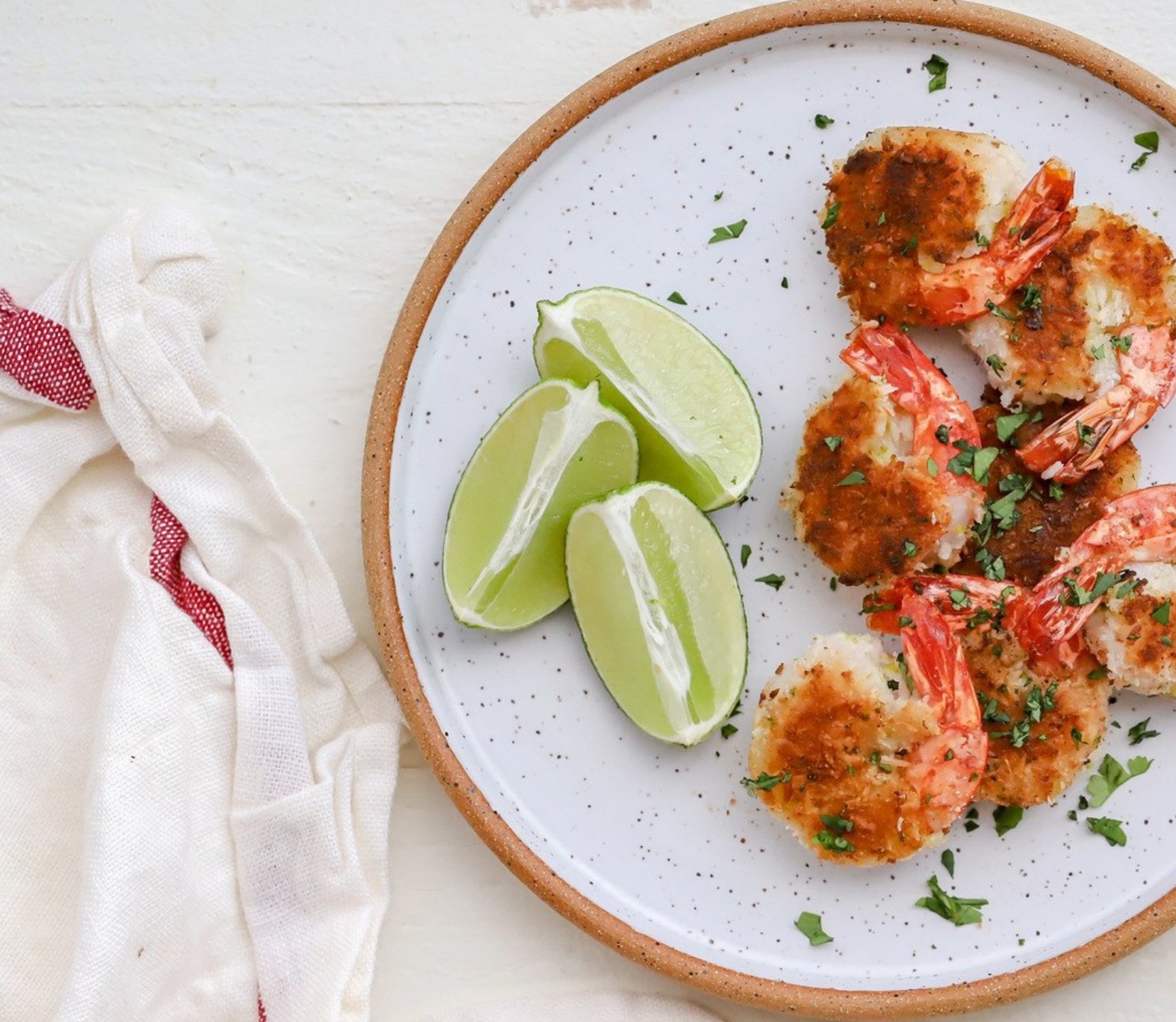Golden crispy coconut shrimp served with dipping sauce—a paleo-friendly, grain-free take on a classic appetizer.