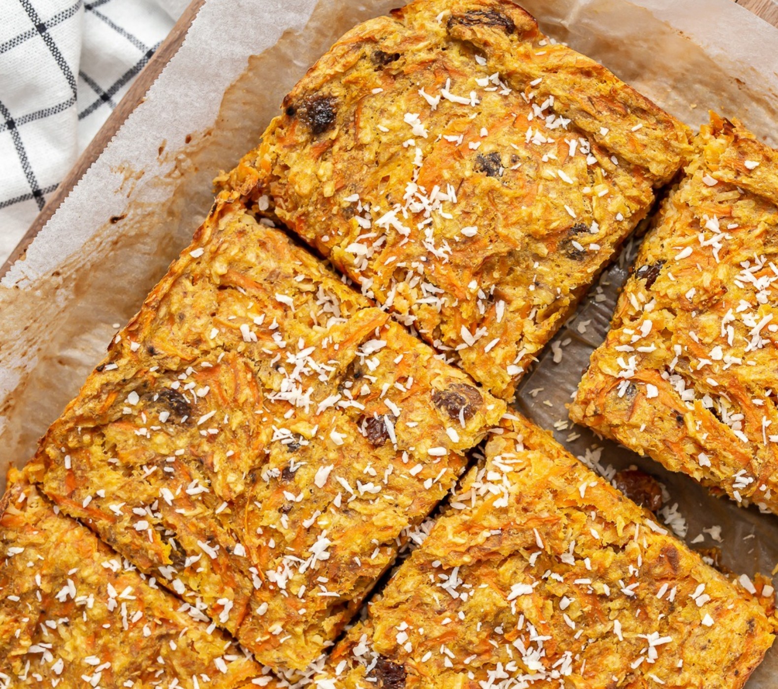Gluten-free carrot and banana n’oatmeal cake topped with shredded coconut—grain-free and perfect for a thyroid-friendly breakfast or snack.