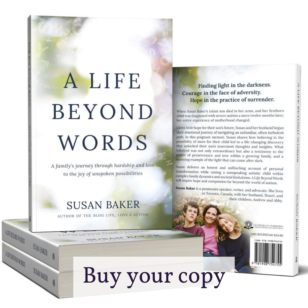 A paperback copy of 'A Life Beyond Words' with author's signature quote card and handmade bookmark from Abby's Joy.