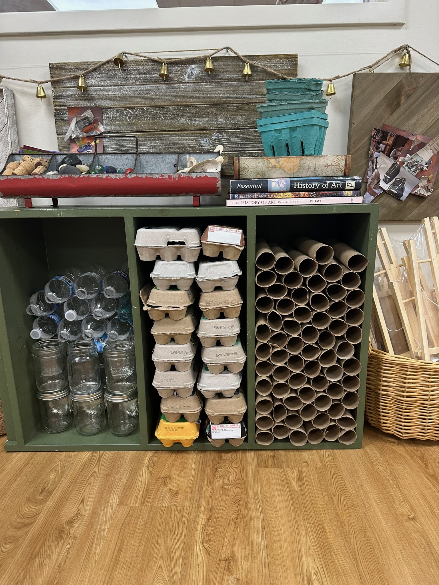 Reggio-inspired loose parts and recycled materials organized for creative building and STEM activities in a preschool classroom.