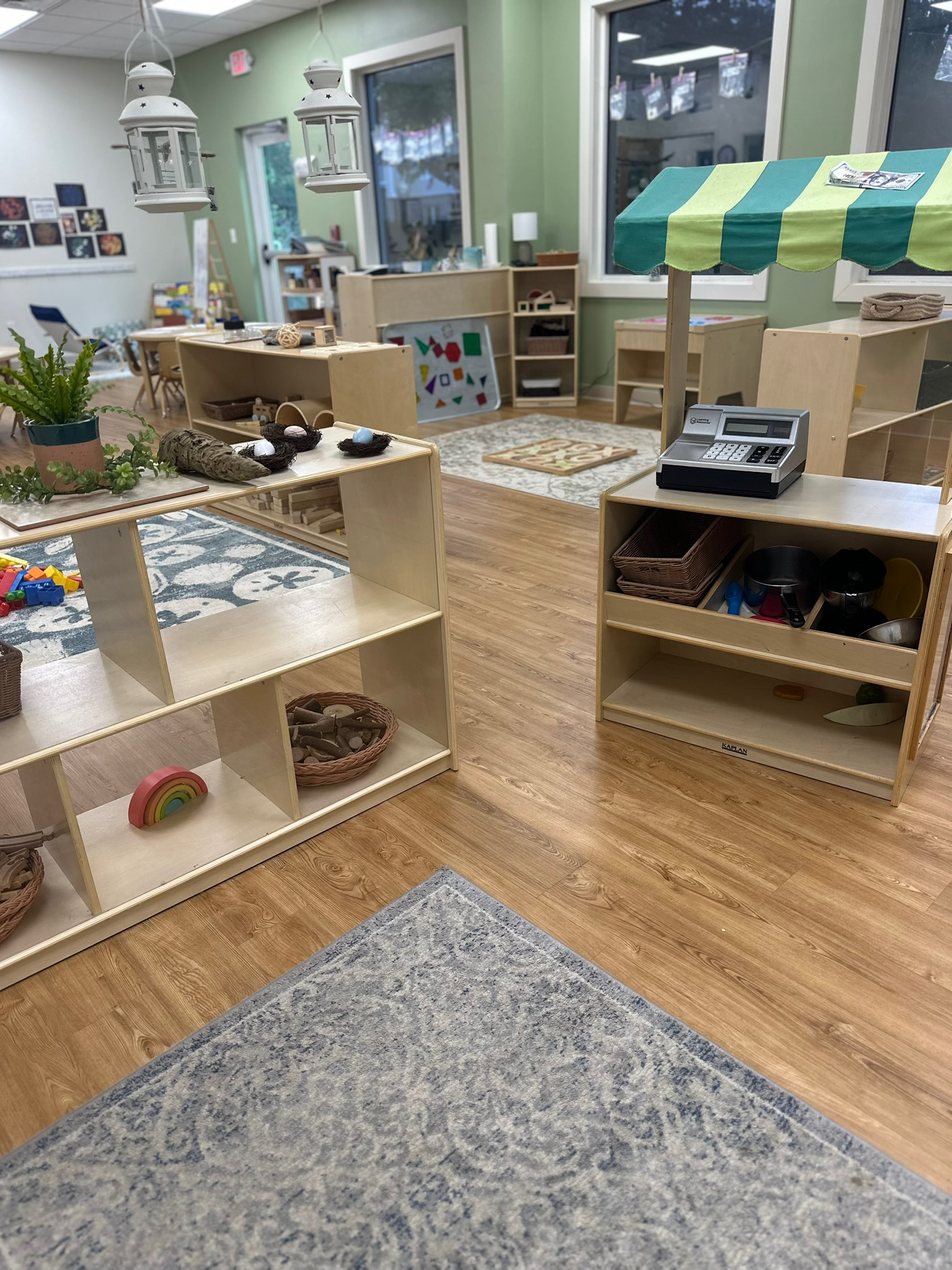 Montessori-inspired preschool classroom at Ivybrook Academy Mount Pleasant with open shelves, natural materials, and hands-on learning areas.