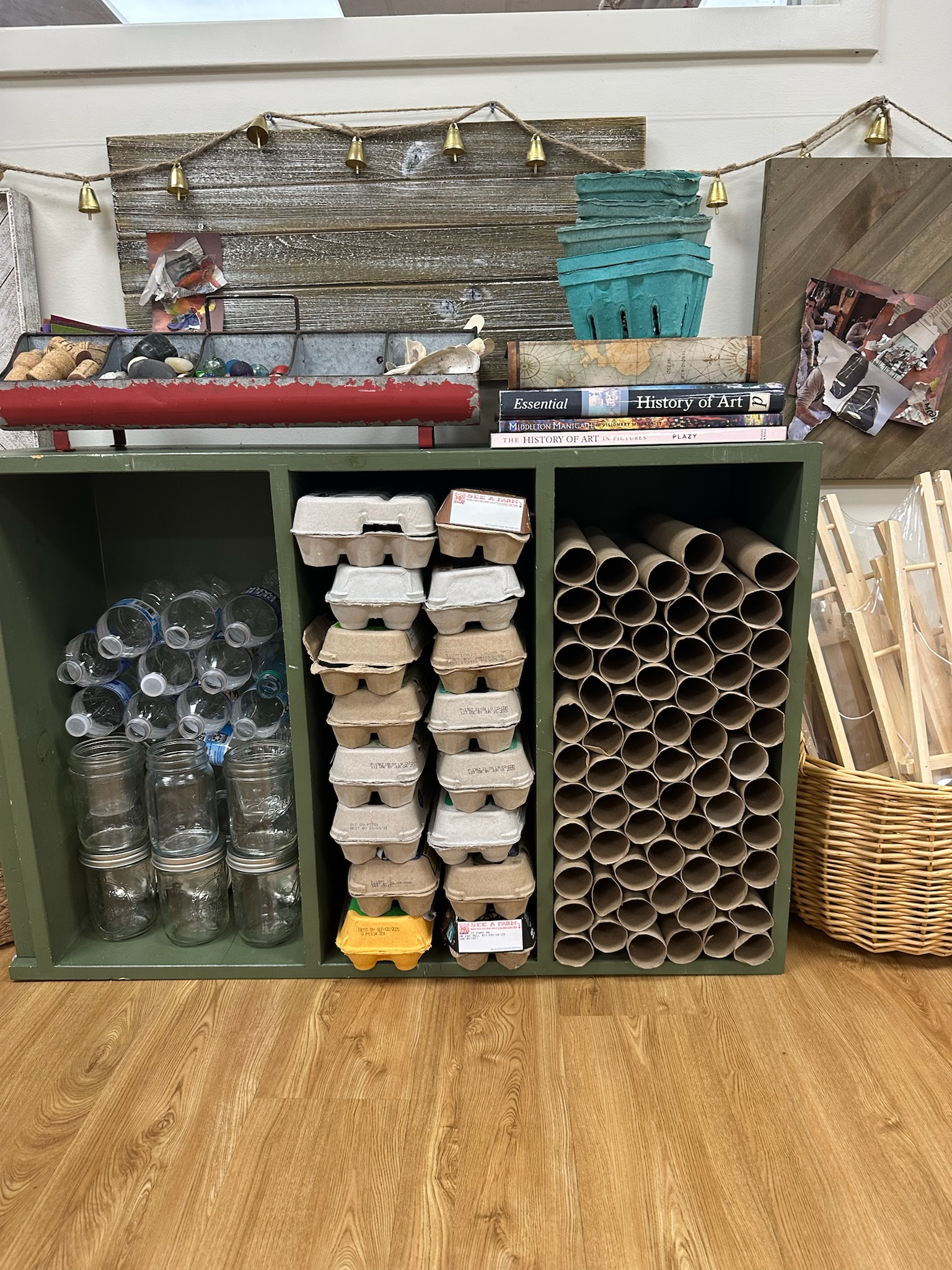 Reggio-inspired loose parts and recycled materials organized for creative building and STEM activities in a preschool classroom.